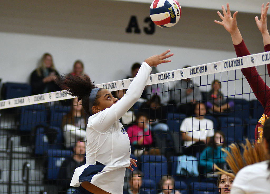 Adianez Rivera hits the ball over the net